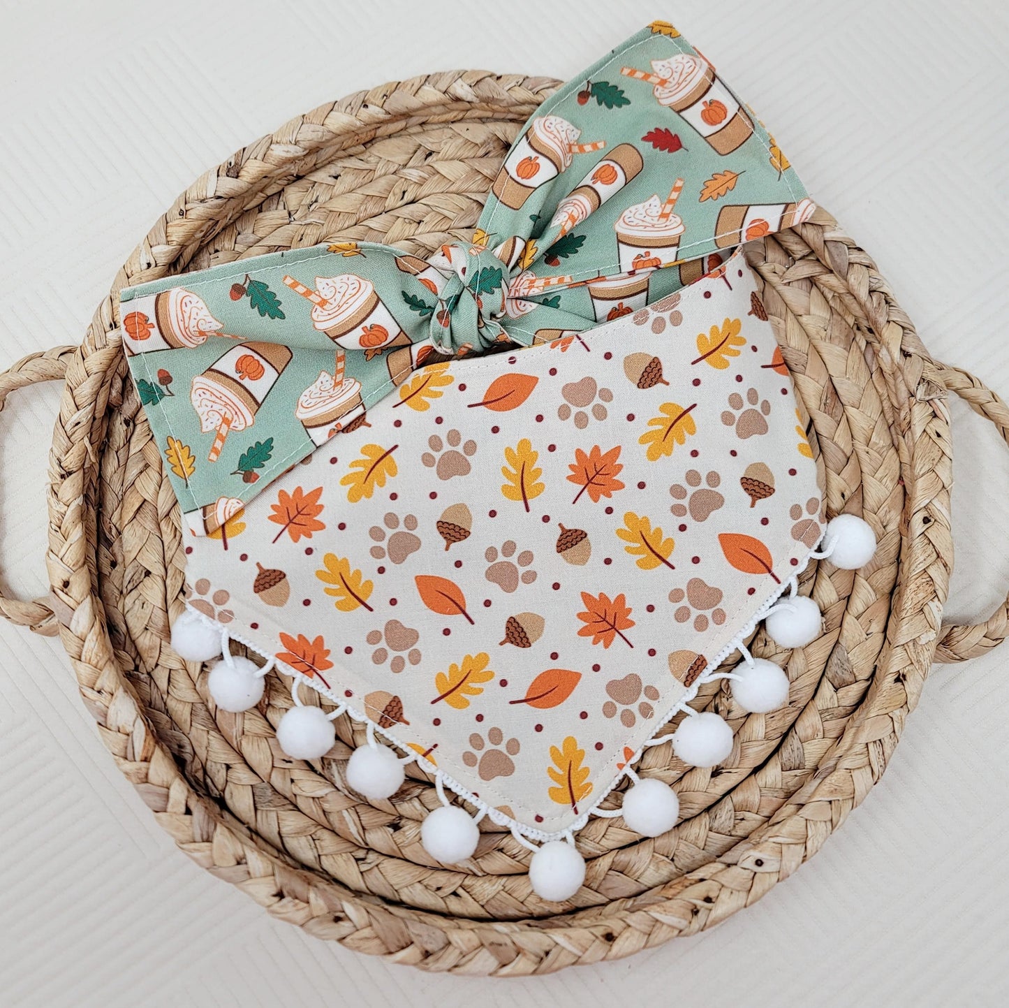 dog bandana with pumpkin spice design, paw prints, and fall leaves