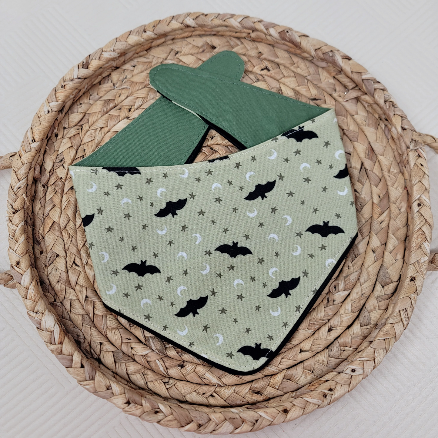 Green dog bandana with "Too Cute To Spook" text and ruffle trim with black bats.