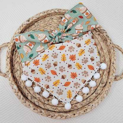 dog bandana with pumpkin spice design, paw prints, and fall leaves 