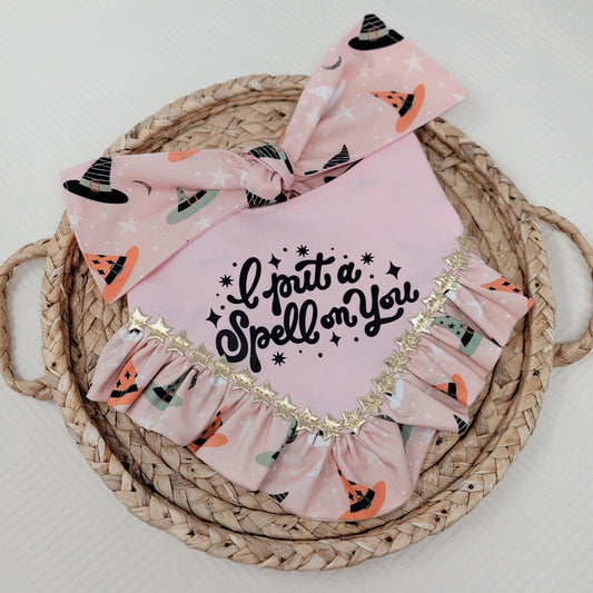 Pink baby dog bandana with 'I put a spell on you' text and witch hat design on back